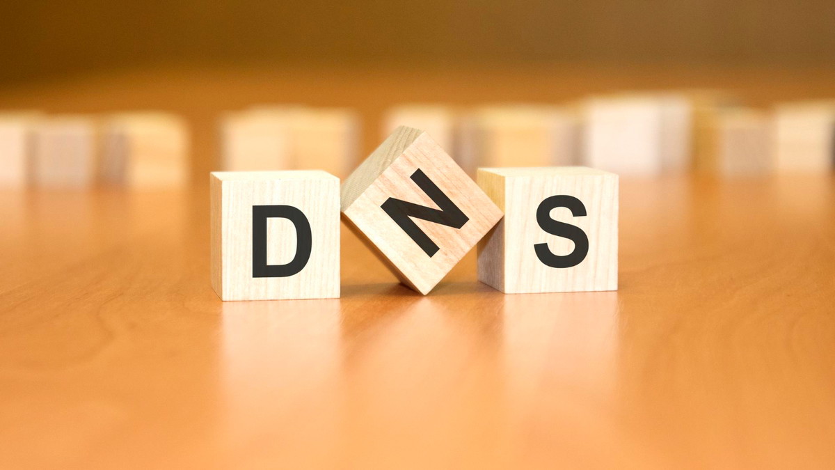 dns-text-wooden-blocks-financial-business-concept-brown-background